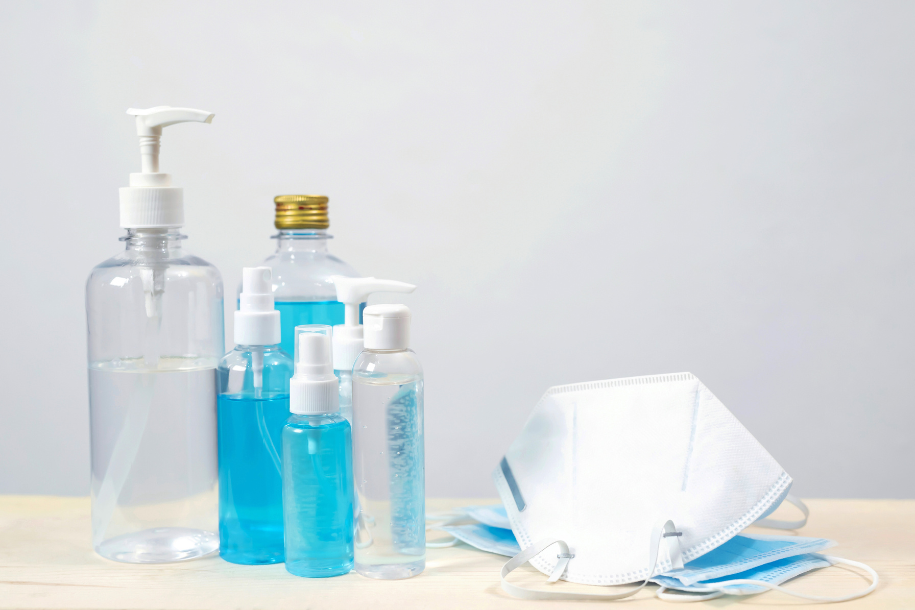 Face Mask and Hand Sanitizers on Table